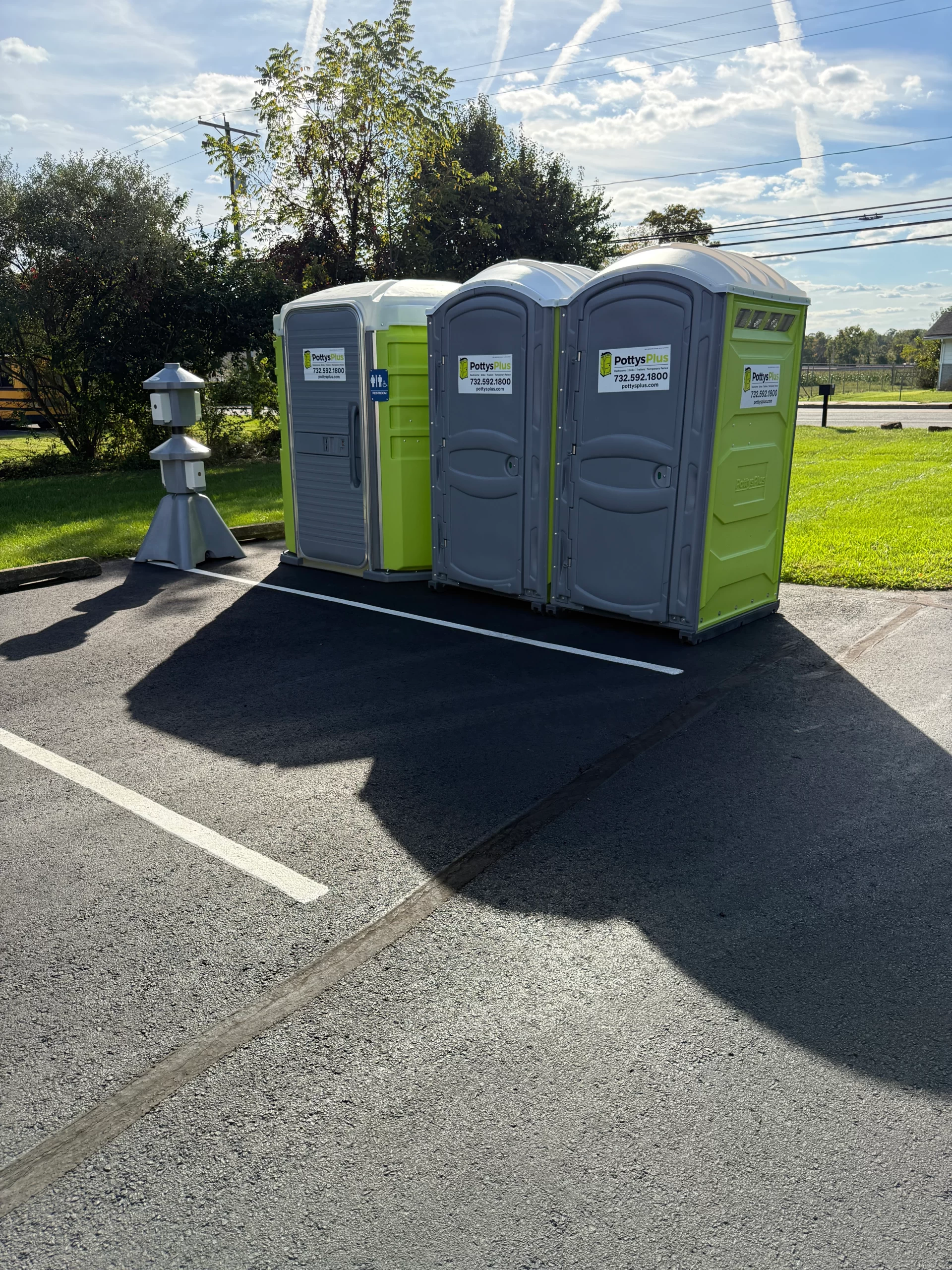 Portable restroom trailer setup at outdoor event in Newark