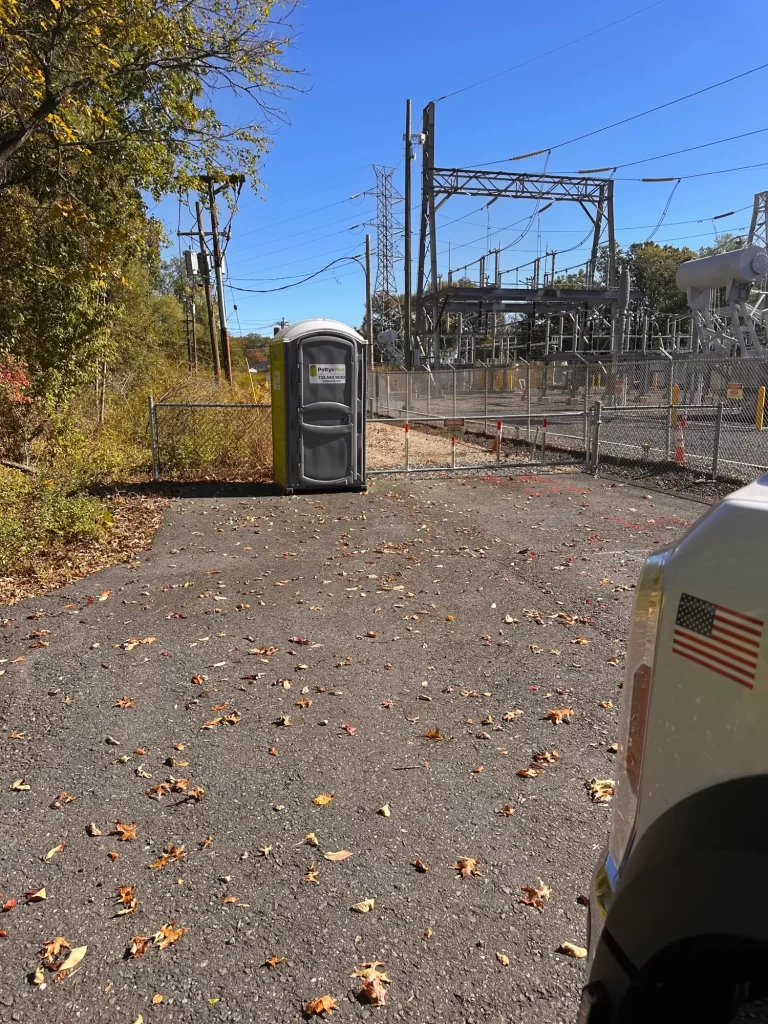 Single portable toilet on rental set up at an active construction site in New Jersey