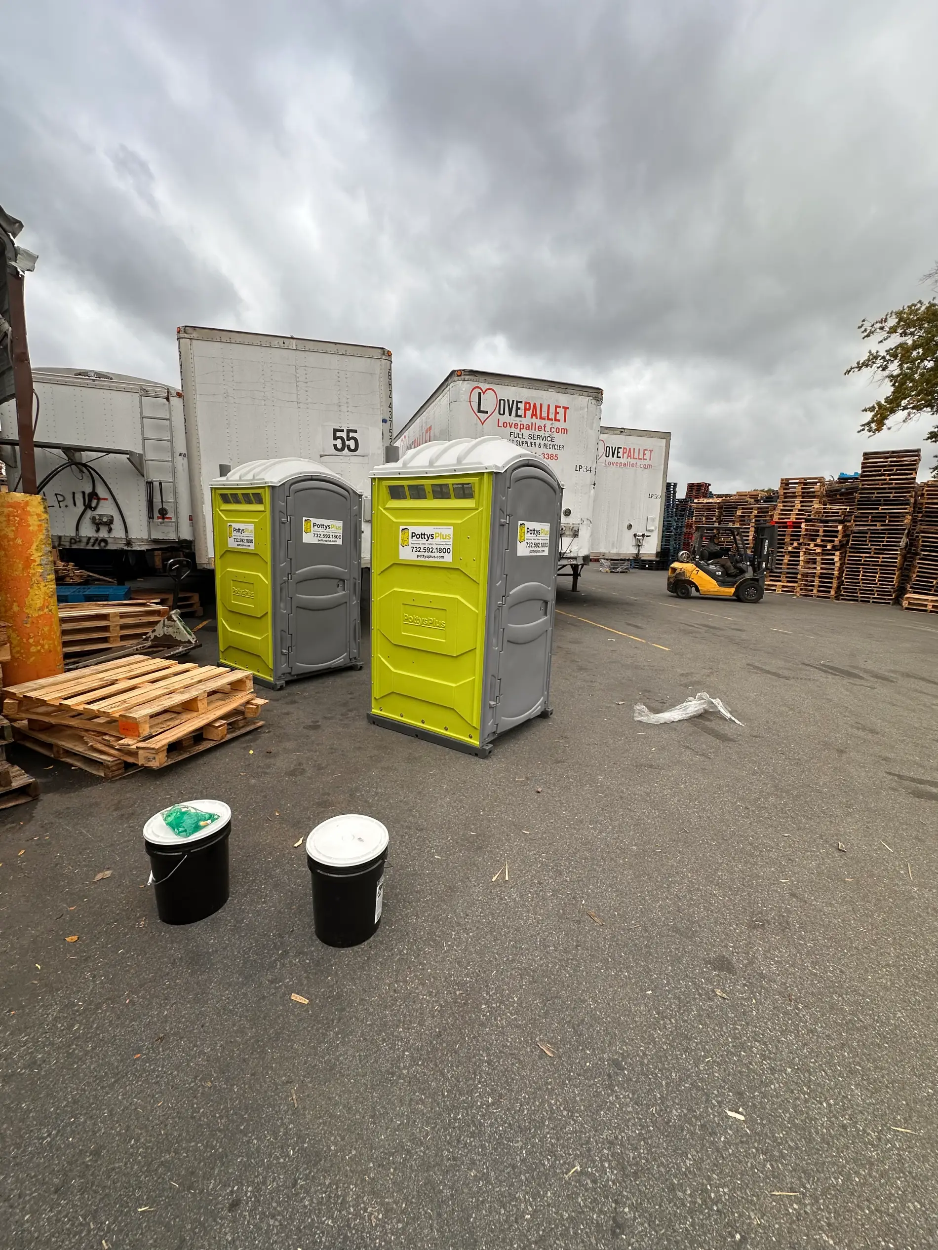 Portable toilets on rental placed at an active job site.