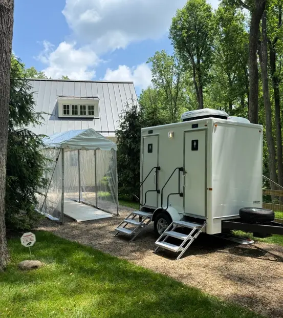 Restroom trailer setup for an event in a Seasonal park.