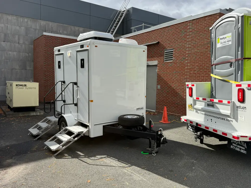 White luxury portable restroom trailer rental.