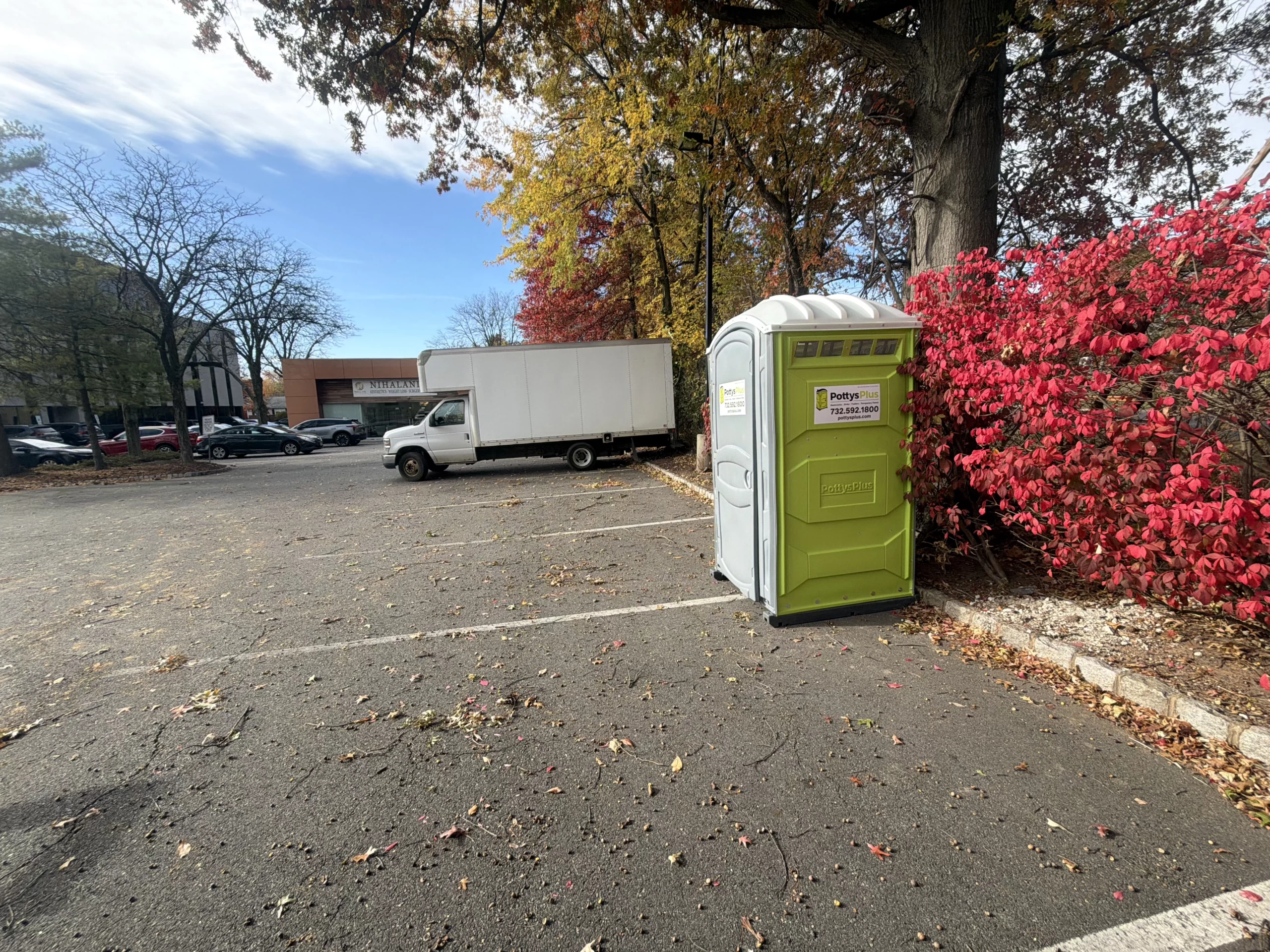 Portable restroom trailer setup at outdoor event in Newark