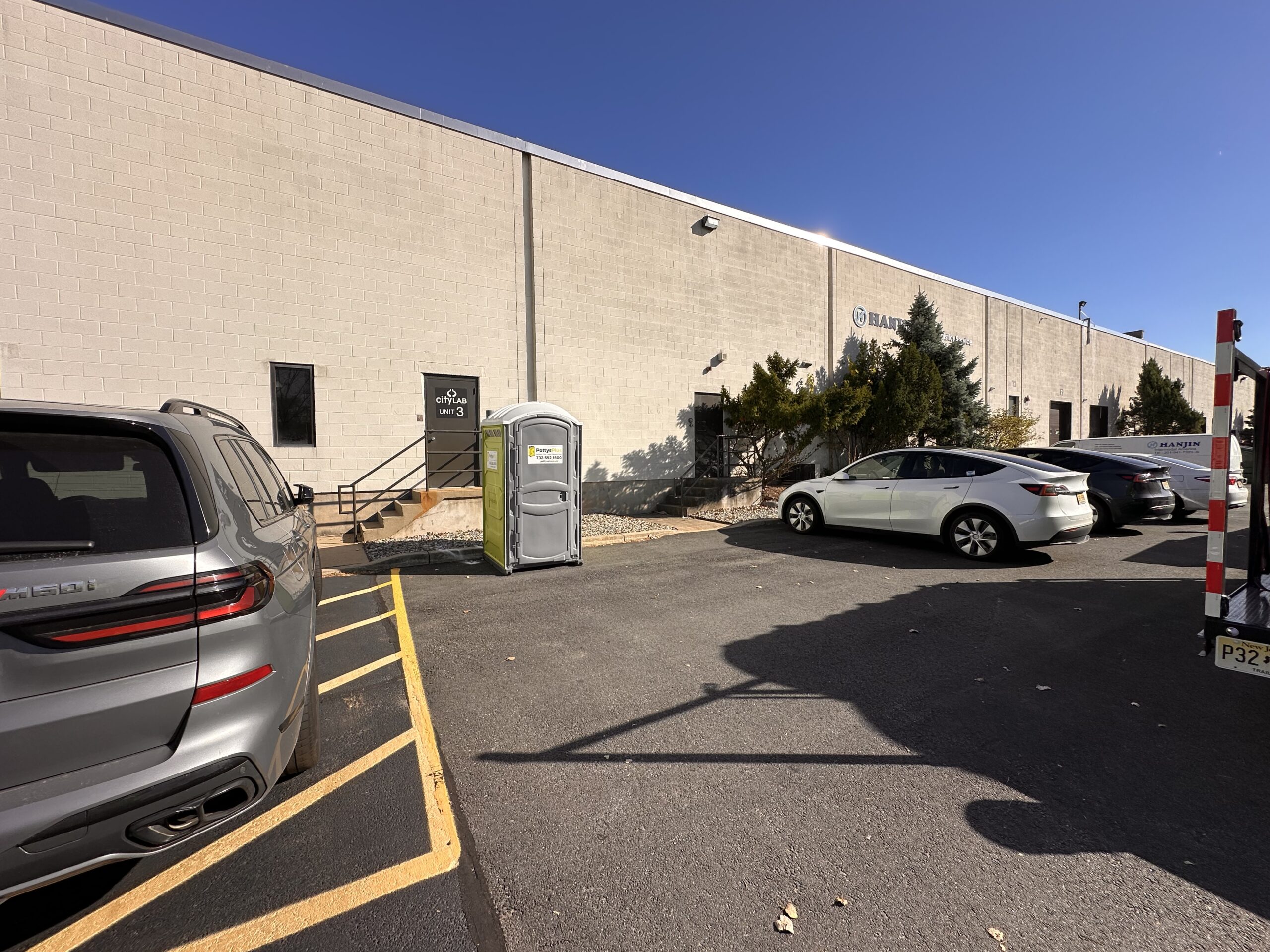 Portable restroom trailer setup at outdoor event in Newark