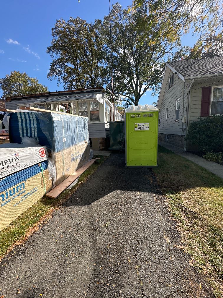 Portable toilet rental placed discreetly at a historic home renovation in Glen Ridge NJ